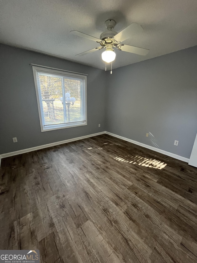 611 Bernhard Rd, Fayetteville, GA 30215 - unfurnished room featuring dark wood finished floors, a ceiling fan, and a textured ceiling