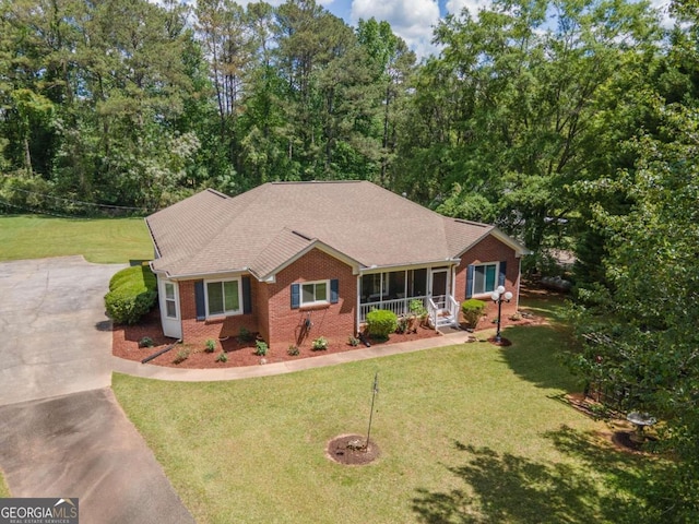 611 Bernhard Rd, Fayetteville, GA 30215 - ranch-style house with brick siding, driveway, and a front yard