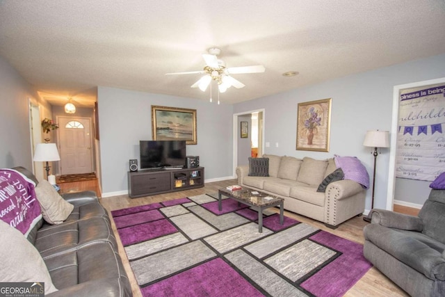 611 Bernhard Rd, Fayetteville, GA 30215 - living room with a ceiling fan and wood finished floors