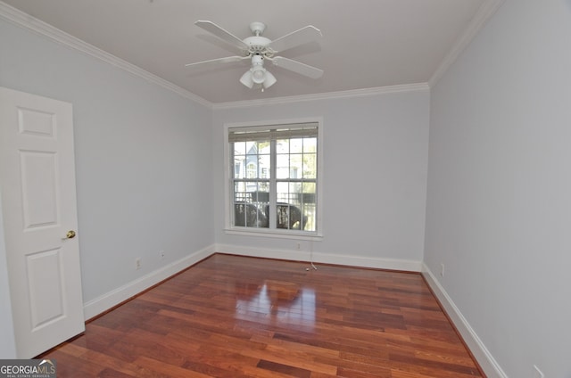 unfurnished room featuring ceiling fan, crown molding, and dark wood-type flooring