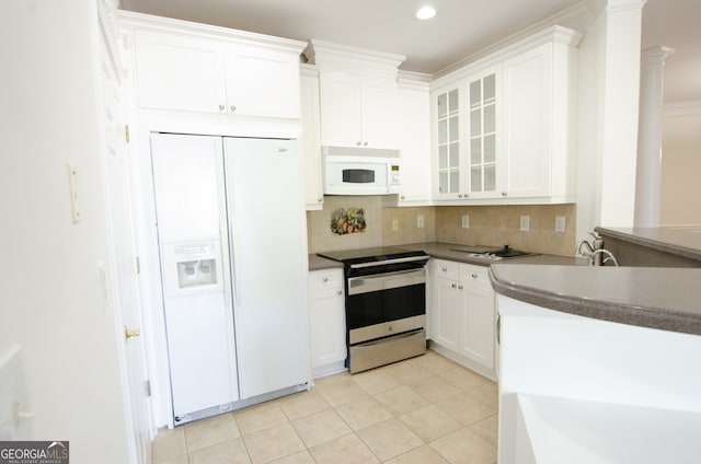 kitchen featuring backsplash, white appliances, crown molding, light tile patterned floors, and white cabinetry