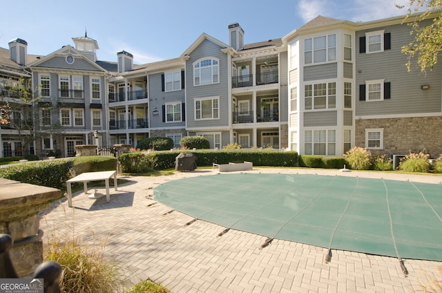 view of swimming pool with a patio