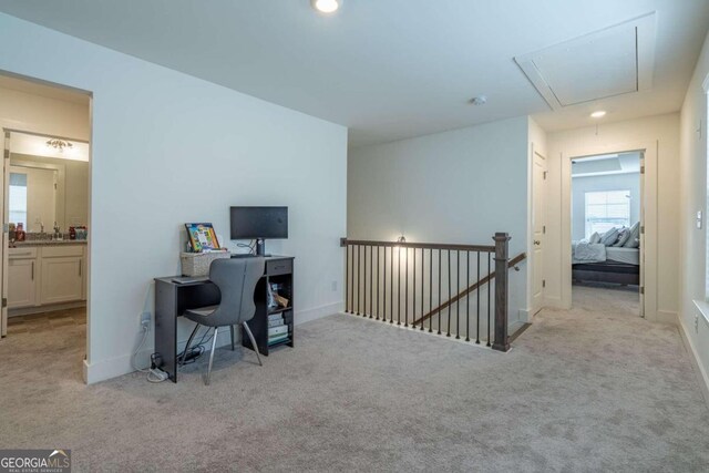 office area with light colored carpet