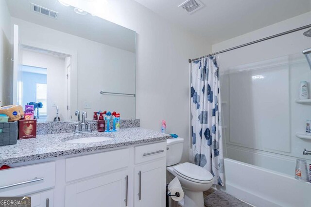 full bathroom featuring vanity, toilet, and shower / bath combo with shower curtain