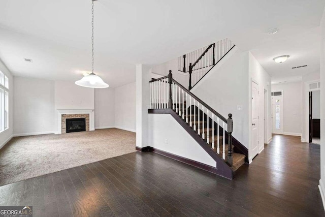 904 Berry Ct, Canton, GA 30114 - unfurnished living room with dark hardwood / wood-style flooring and a fireplace