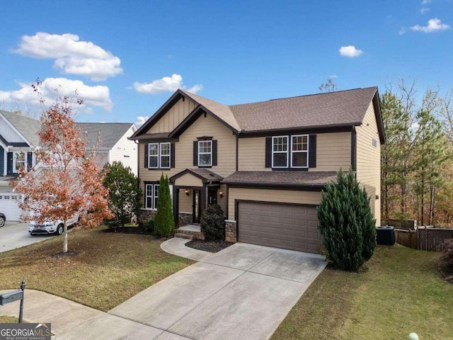 craftsman inspired home featuring central AC unit, a garage, and a front lawn