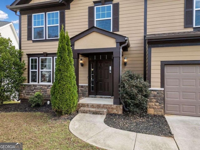 doorway to property featuring a garage