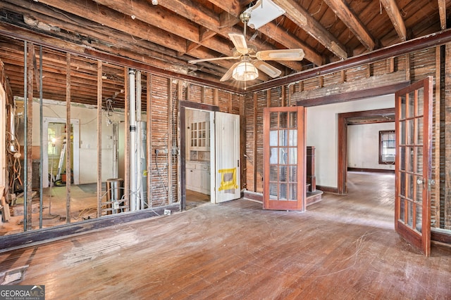 misc room featuring beamed ceiling, french doors, and ceiling fan