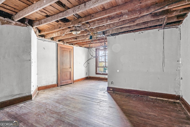 basement with hardwood / wood-style floors and wood ceiling