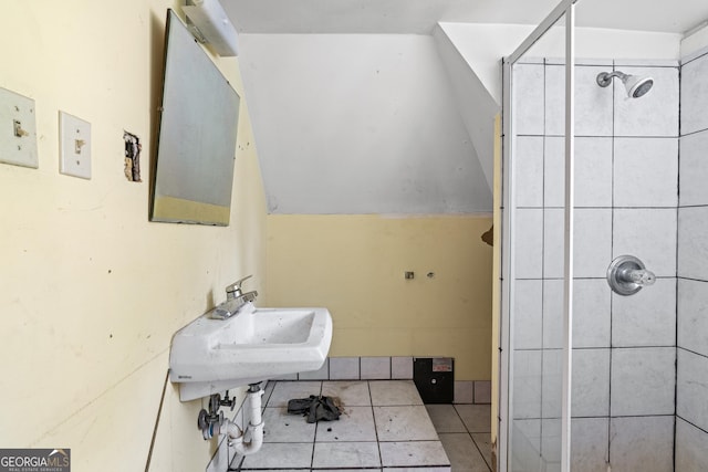 bathroom with tile patterned floors, sink, and walk in shower