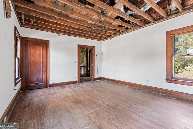 empty room with hardwood / wood-style floors