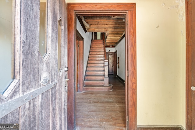 hallway with dark hardwood / wood-style floors