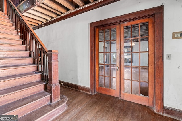 stairway featuring wood-type flooring