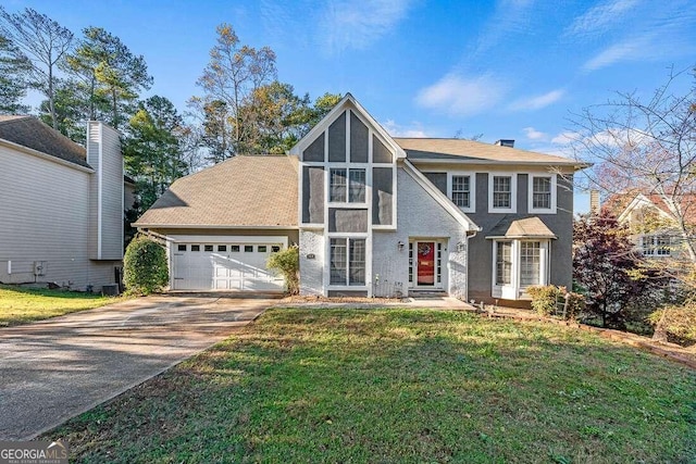 view of front facade featuring a front yard and a garage