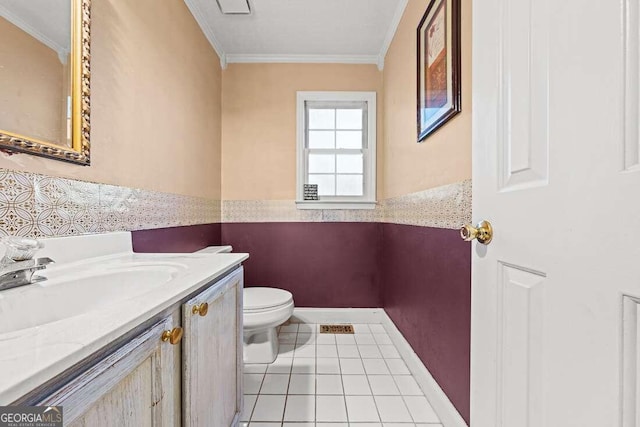 bathroom featuring tile patterned floors, vanity, toilet, and ornamental molding