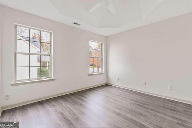 unfurnished room featuring hardwood / wood-style flooring and ceiling fan