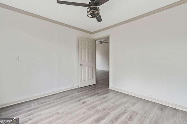 spare room with ceiling fan, crown molding, and light hardwood / wood-style flooring