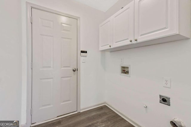 washroom featuring hookup for an electric dryer, washer hookup, dark hardwood / wood-style flooring, and cabinets