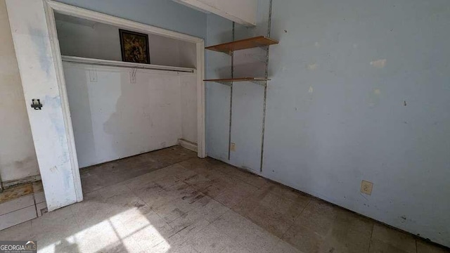 unfurnished bedroom with a closet