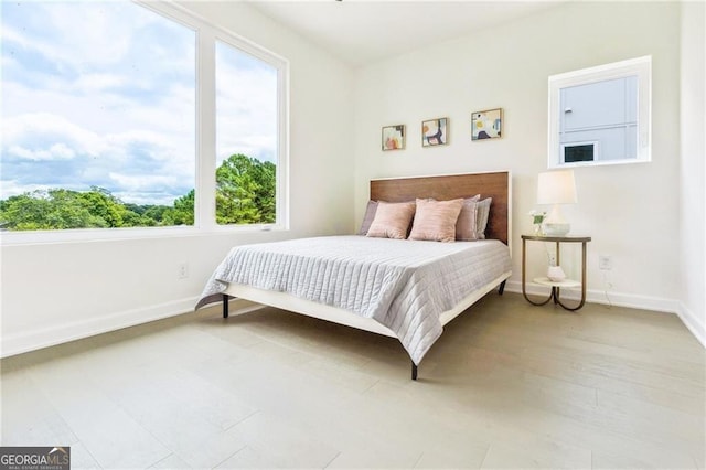 bedroom with light hardwood / wood-style floors