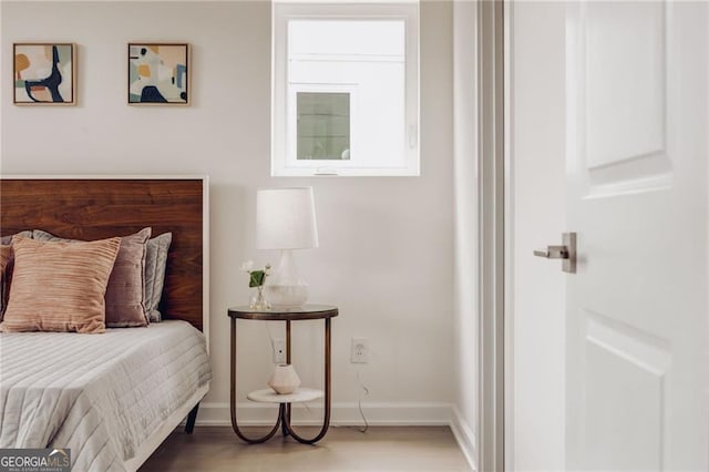 bedroom with hardwood / wood-style flooring