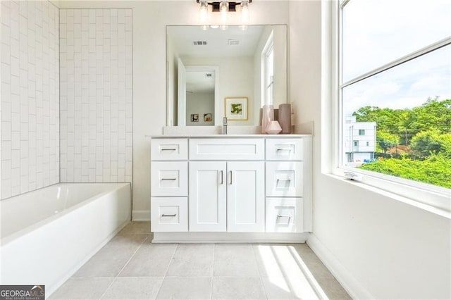 bathroom with tile patterned flooring and vanity