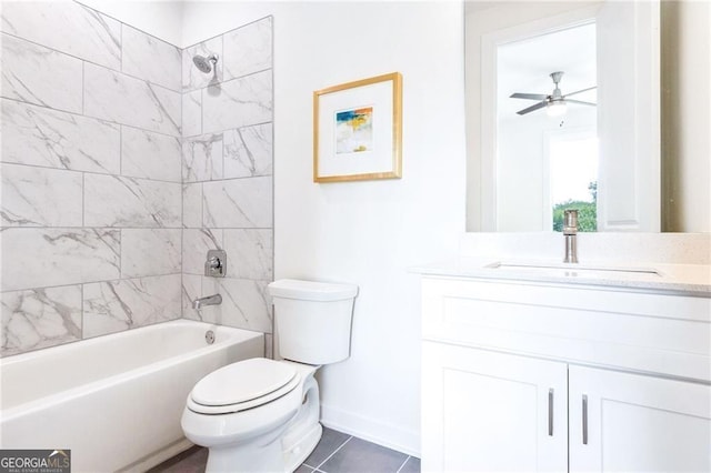 full bathroom featuring tile patterned floors, vanity, ceiling fan, toilet, and tiled shower / bath