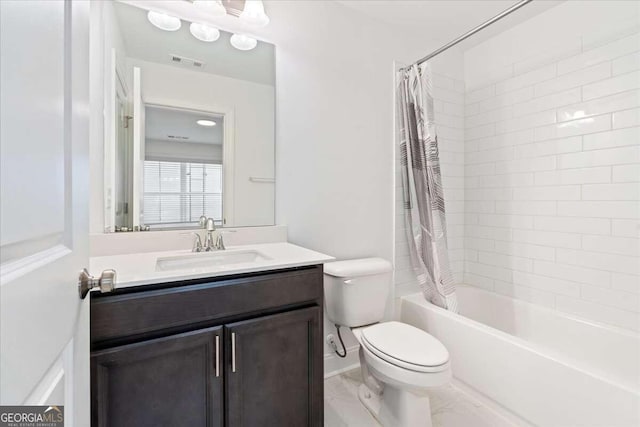 full bathroom with vanity, shower / bath combination with curtain, and toilet