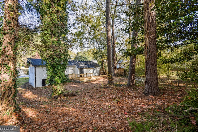 view of yard with a wooden deck