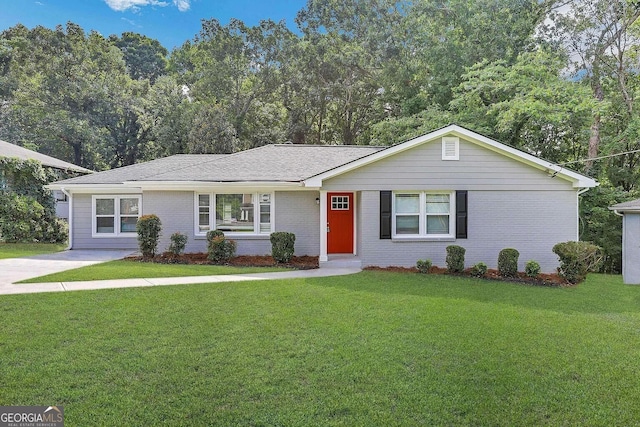 single story home featuring a front yard