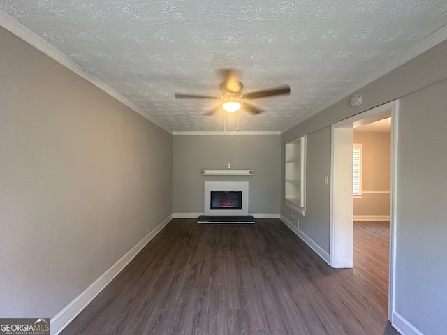 unfurnished living room featuring a textured ceiling, crown molding, ceiling fan, and dark hardwood / wood-style floors