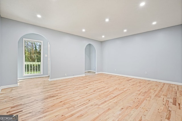 spare room featuring light hardwood / wood-style floors