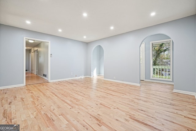 spare room featuring light hardwood / wood-style flooring