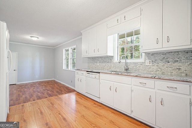 kitchen featuring light wood-type flooring, white appliances, white cabinets, and sink