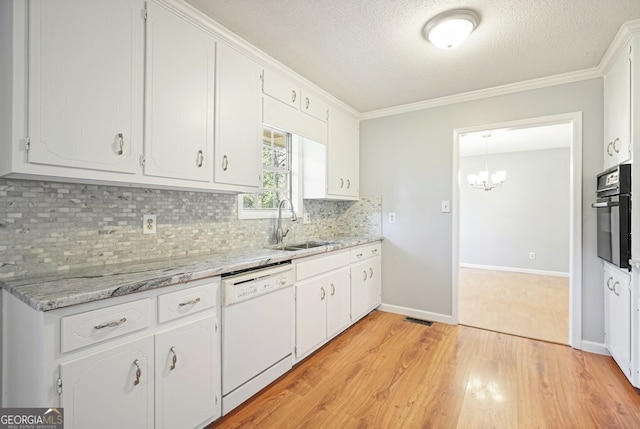 kitchen featuring dishwasher, white cabinetry, oven, and light hardwood / wood-style floors