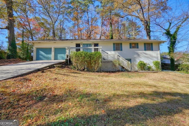 single story home with a garage and a front yard