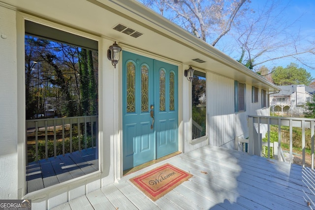 property entrance featuring covered porch