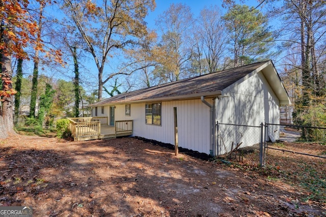 view of side of property featuring a deck