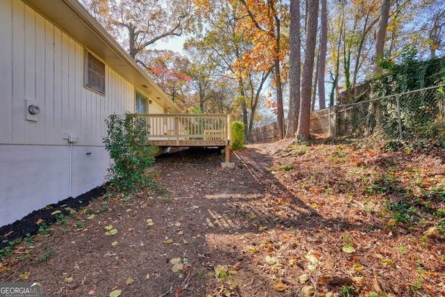 view of yard featuring a wooden deck