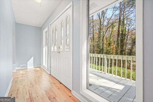 foyer entrance with light hardwood / wood-style floors