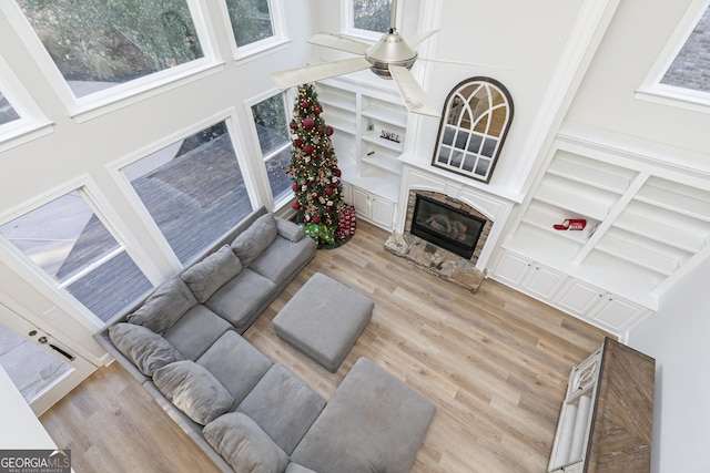 living room featuring a fireplace and light hardwood / wood-style flooring