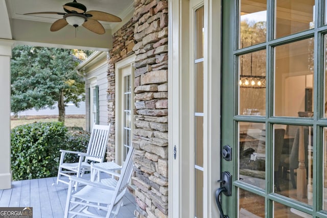 exterior space with ceiling fan and a porch