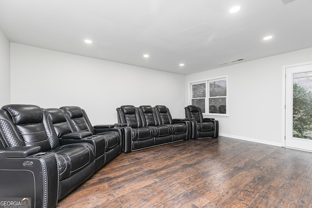 cinema room featuring dark wood-type flooring