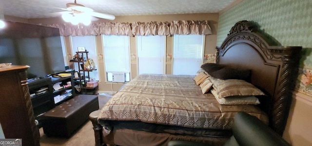 bedroom featuring ceiling fan, cooling unit, and a textured ceiling