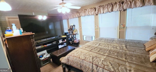 bedroom featuring ceiling fan and cooling unit