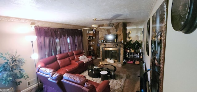 living room featuring a fireplace, a textured ceiling, and ceiling fan