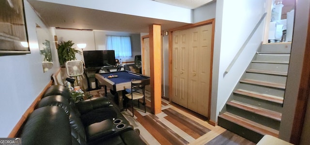 home office with pool table and hardwood / wood-style flooring