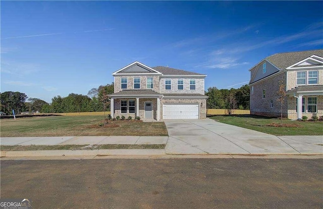 view of front facade featuring a front yard and a garage