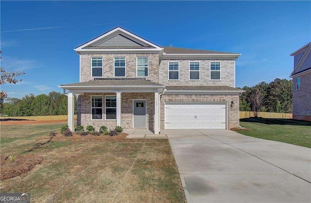 view of front of home featuring a garage and a front lawn