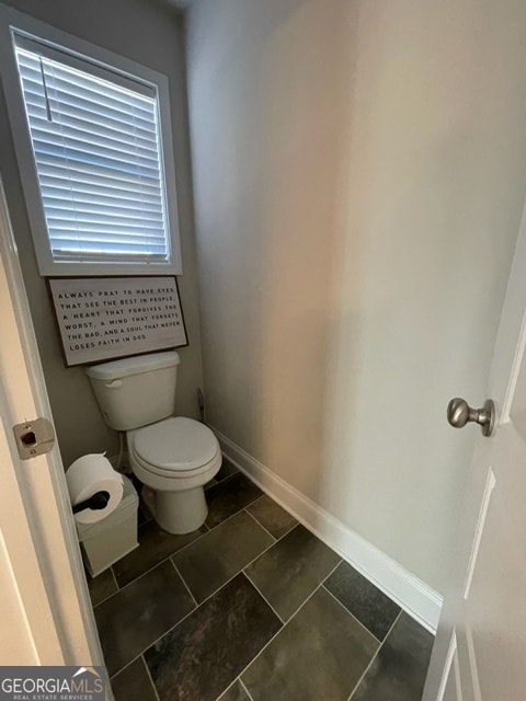 bathroom with tile patterned floors and toilet